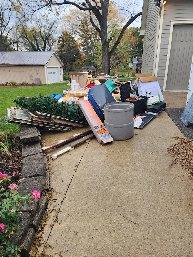 Dumpster being loaded with debris for Commercial Dumpster Rental in Fellsmere